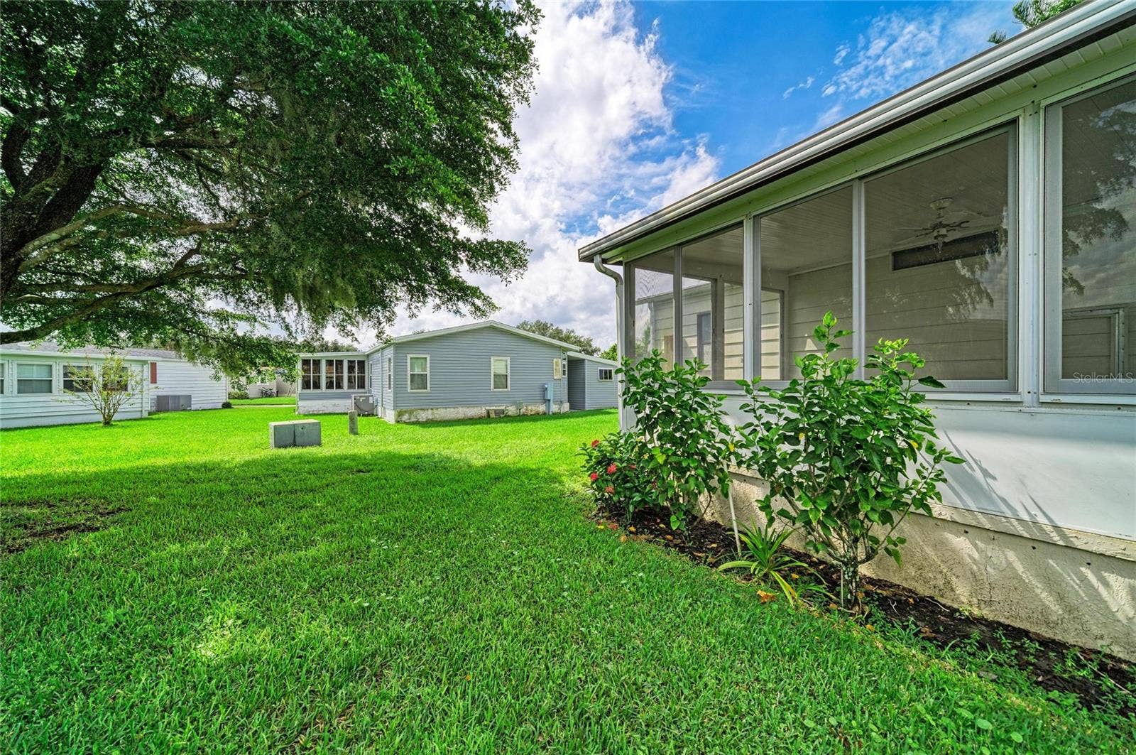 42 MEADOWLARK CIRCLE, Ellenton, FL 34222 Nice shade tree from sunroom. with this lot you are not right on top of your neighbors. add rolldown shades for privacy. With the directional exposure you get morning sun and are spared the blazing afternoon sun