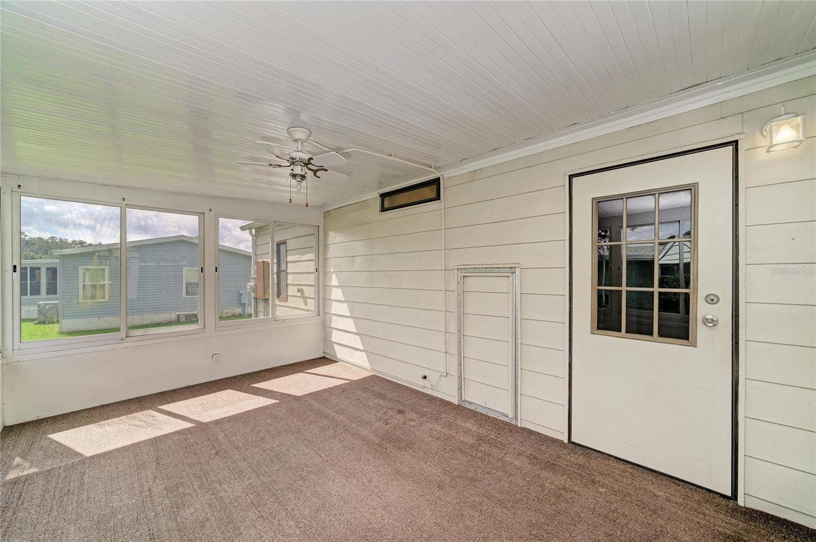 42 MEADOWLARK CIRCLE, Ellenton, FL 34222 Alternate view of sunroom. Water heater is behind the small opening door. Plenty of opportunity to make it the way youd like.