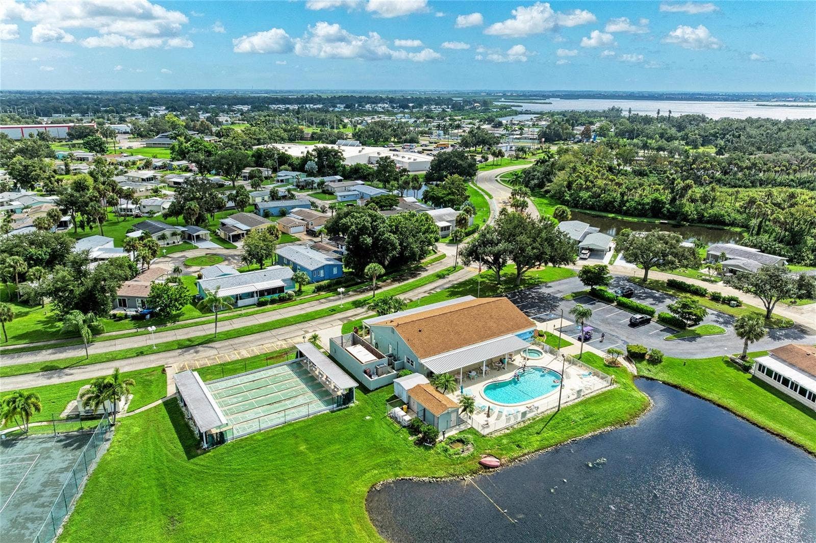 42 MEADOWLARK CIRCLE, Ellenton, FL 34222 View of clubhouse, shuffleboard courts amd community pool
