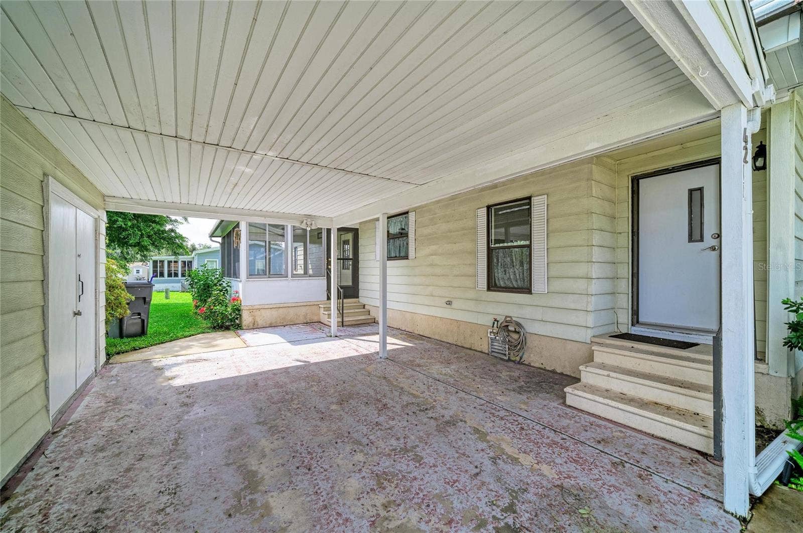 42 MEADOWLARK CIRCLE, Ellenton, FL 34222 Deep carport with room for golf cart