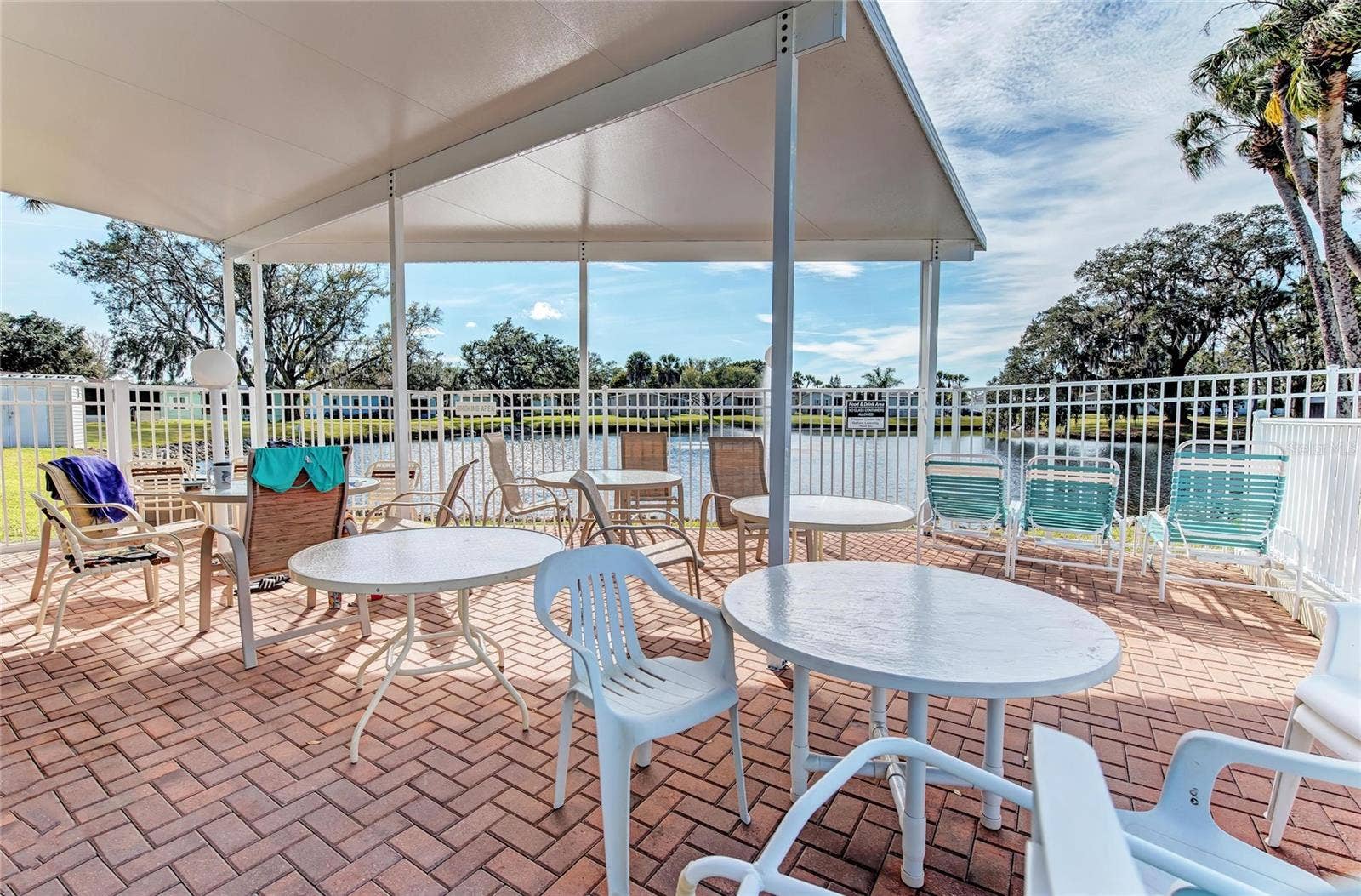 42 MEADOWLARK CIRCLE, Ellenton, FL 34222 Covered gathering area at pool and clubhouse