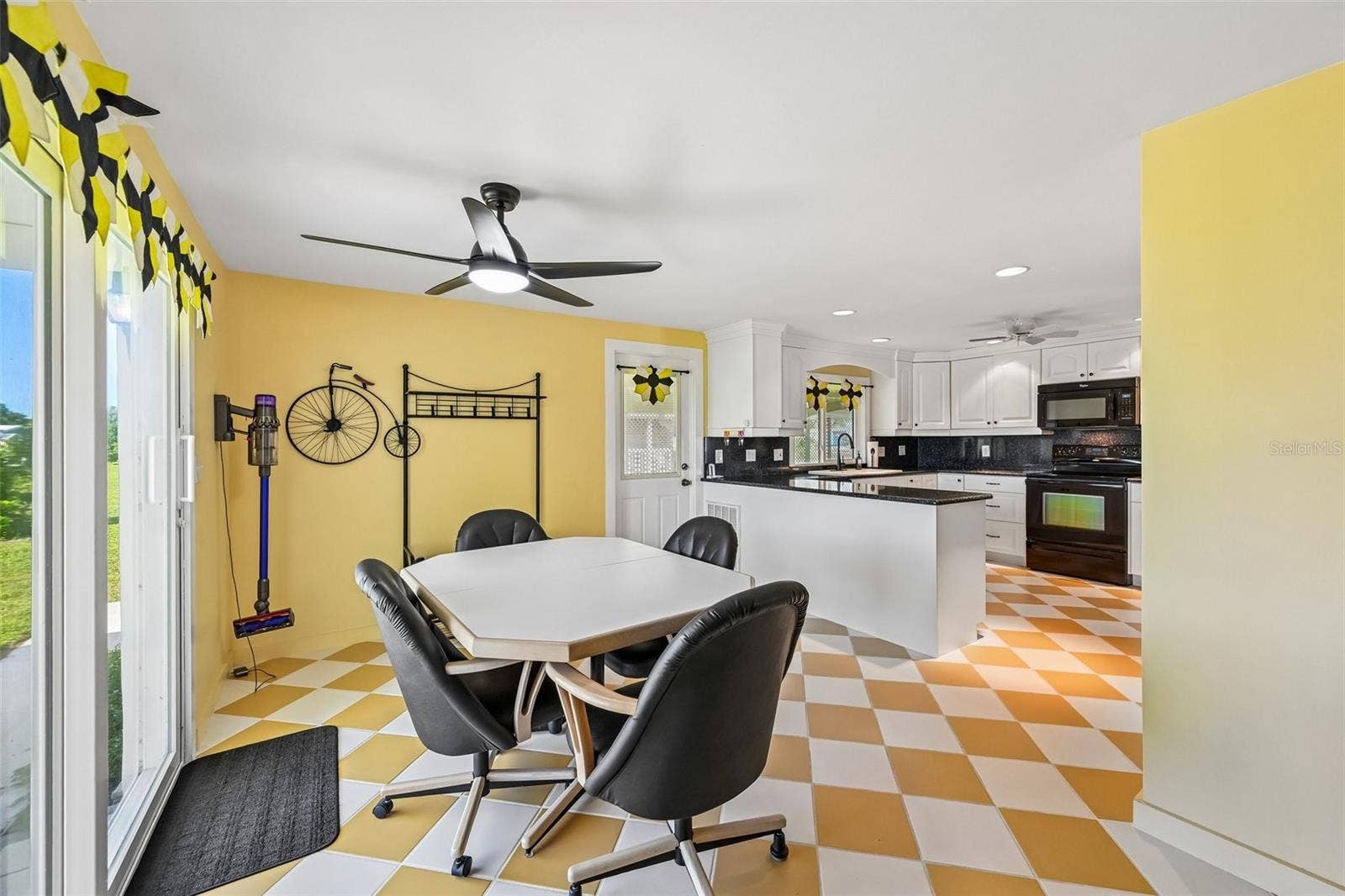 8455 ALBATROSS LANE, Englewood, FL 34224 Open kitchen with stone counters right inside the front door