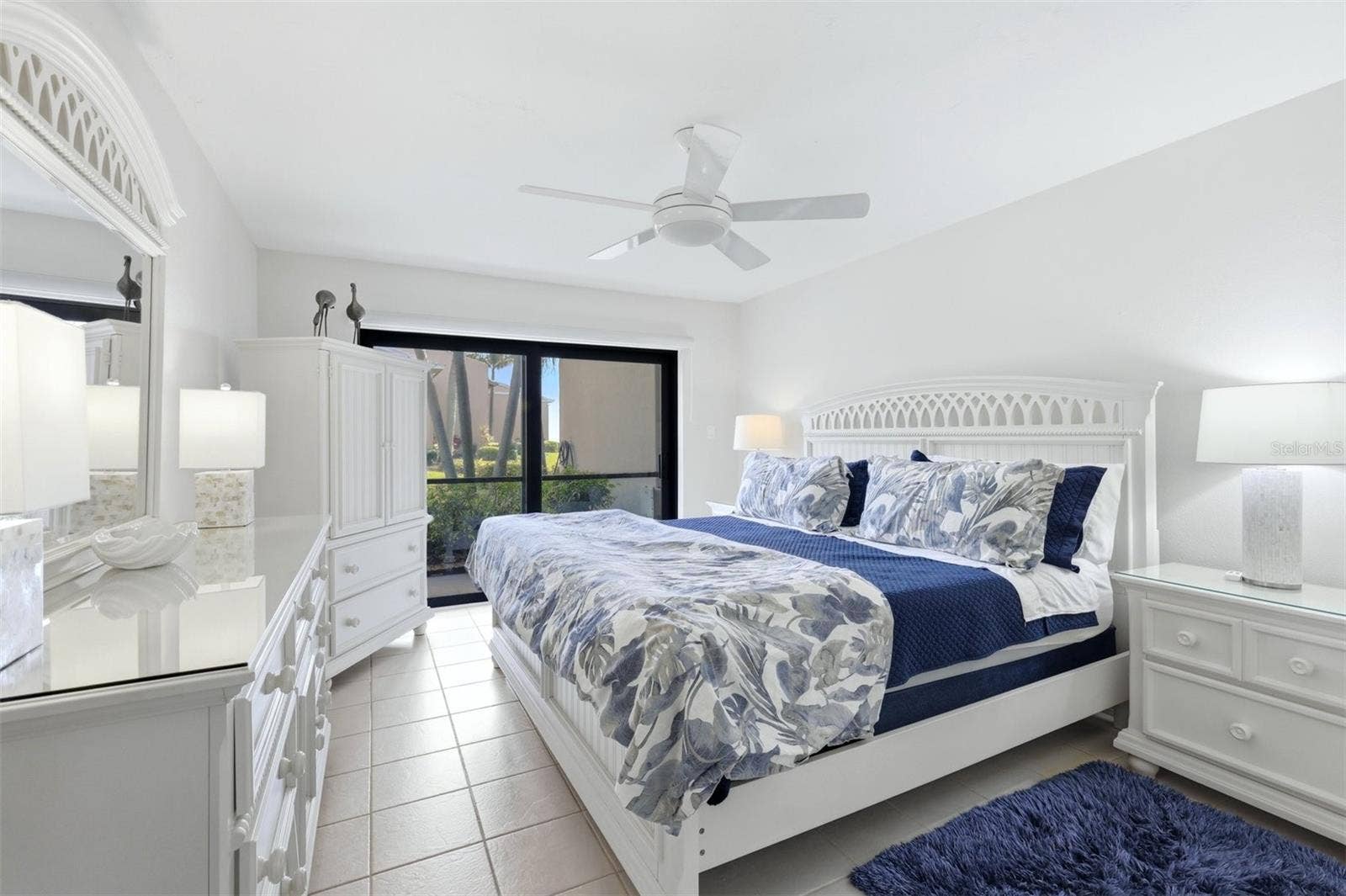 5655 GULF OF MEXICO DRIVE, #A107, Longboat Key, FL 34228 Primary bedroom with impact rated slider to lanai