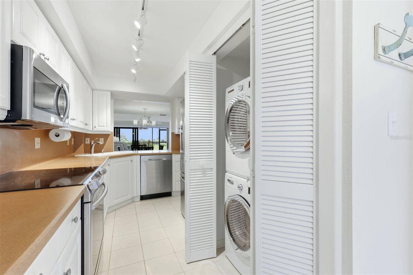 5655 GULF OF MEXICO DRIVE, #A107, Longboat Key, FL 34228 Kitchen with washer/dryer