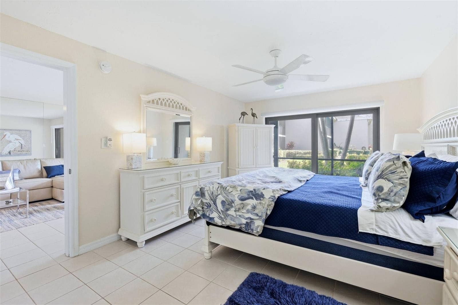 5655 GULF OF MEXICO DRIVE, #A107, Longboat Key, FL 34228 Primary bedroom with impact rated slider to lanai