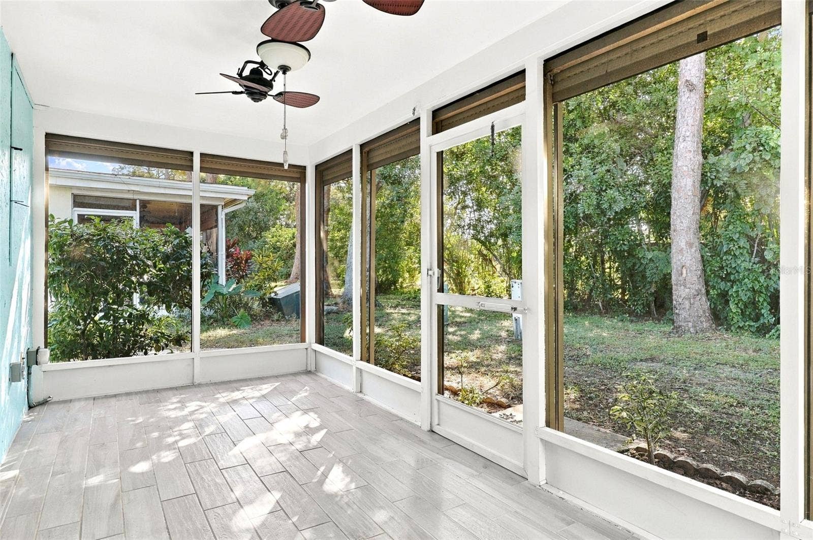 6272 GREEN VIEW CIR, #114, Sarasota, FL 34231 Lanai with motorized roll-down shutters