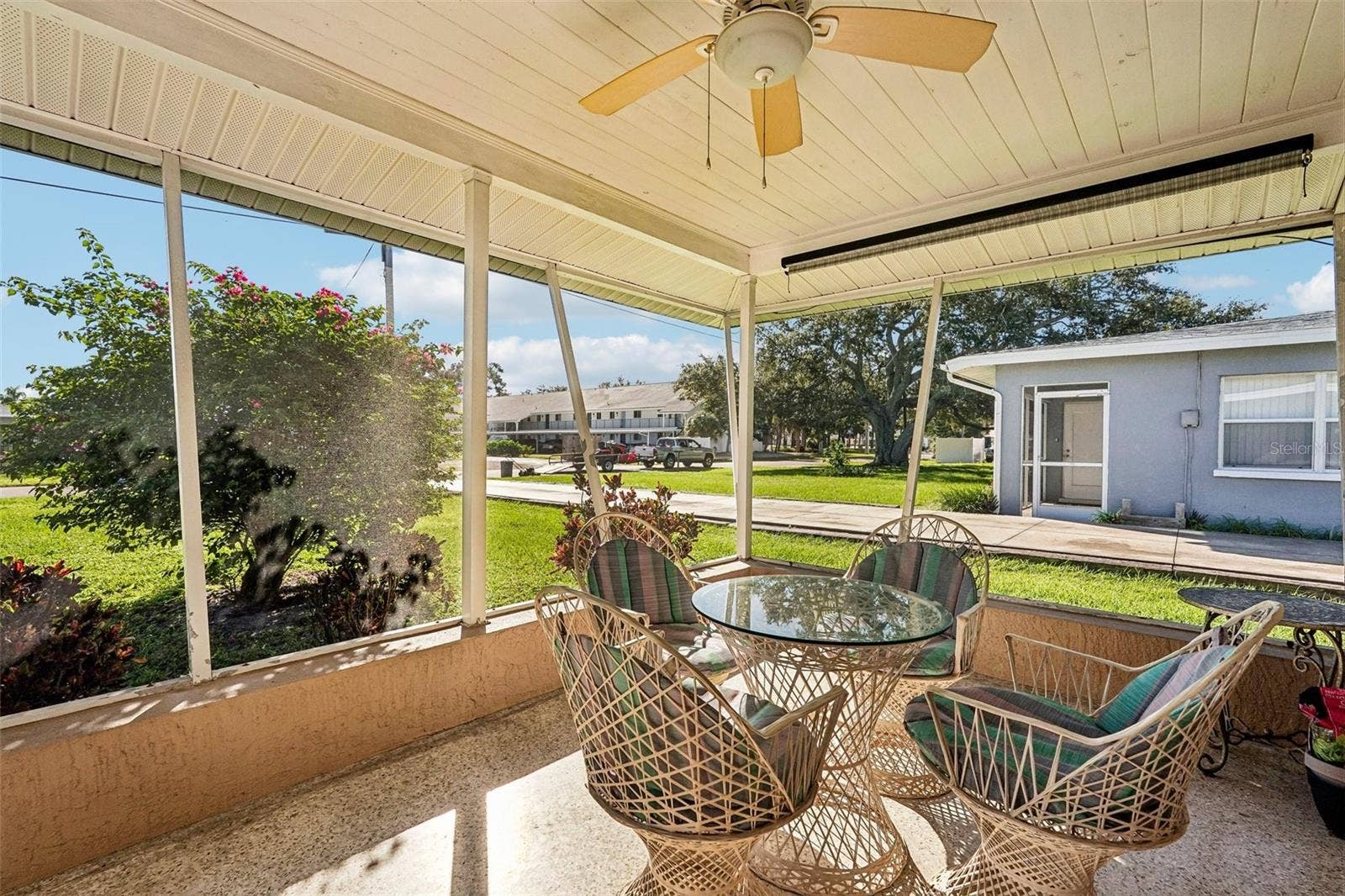309 - Step outside your living room to the private screened lanai.