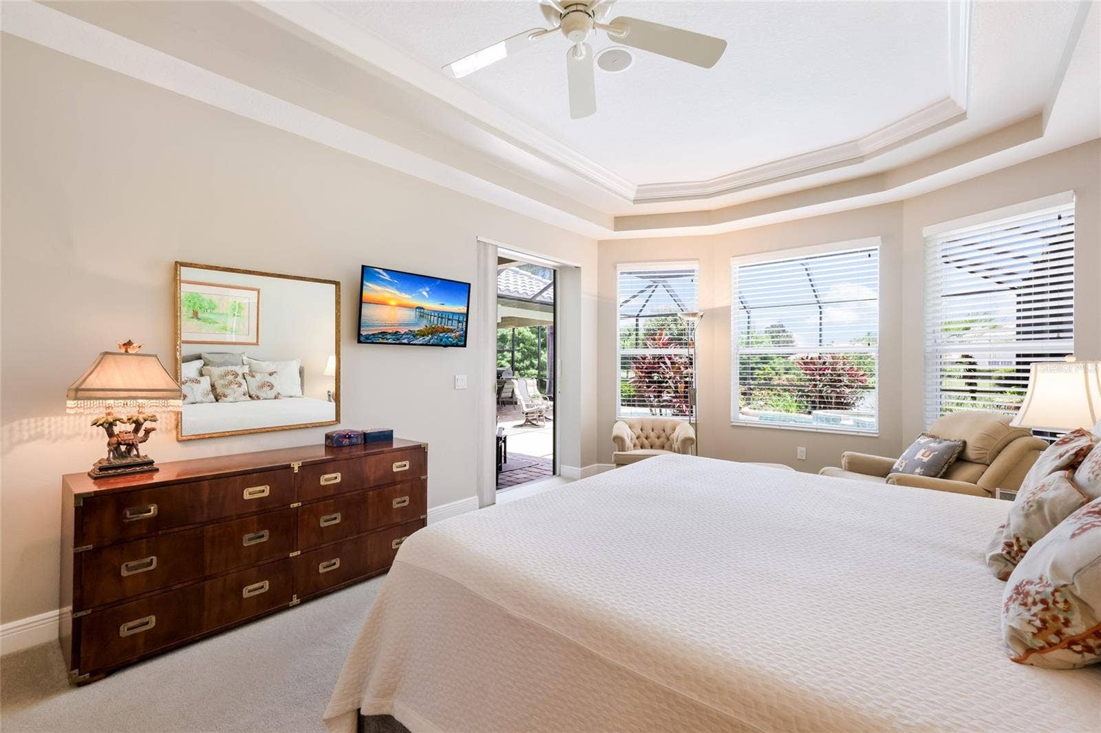 13409 KILDARE PLACE, Lakewood Ranch, FL 34202 Primary suite has bay window sitting area and pocket slider to lanai