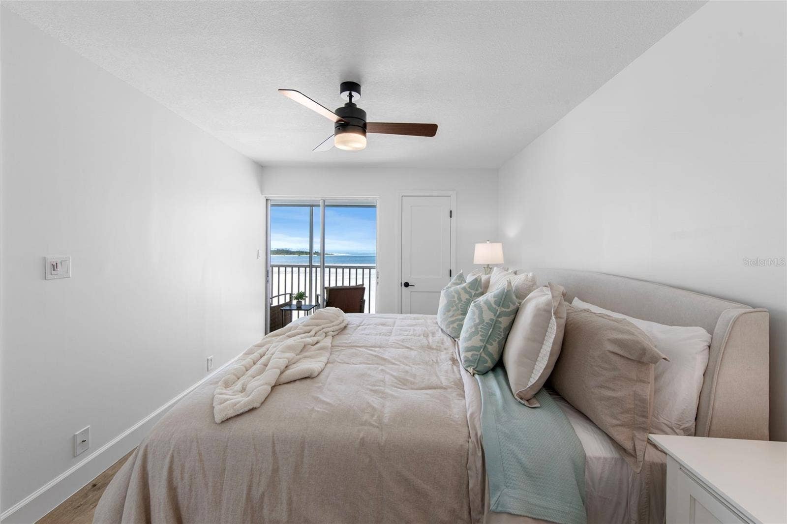 Primary suite with direct lanai access and Gulf/beach views