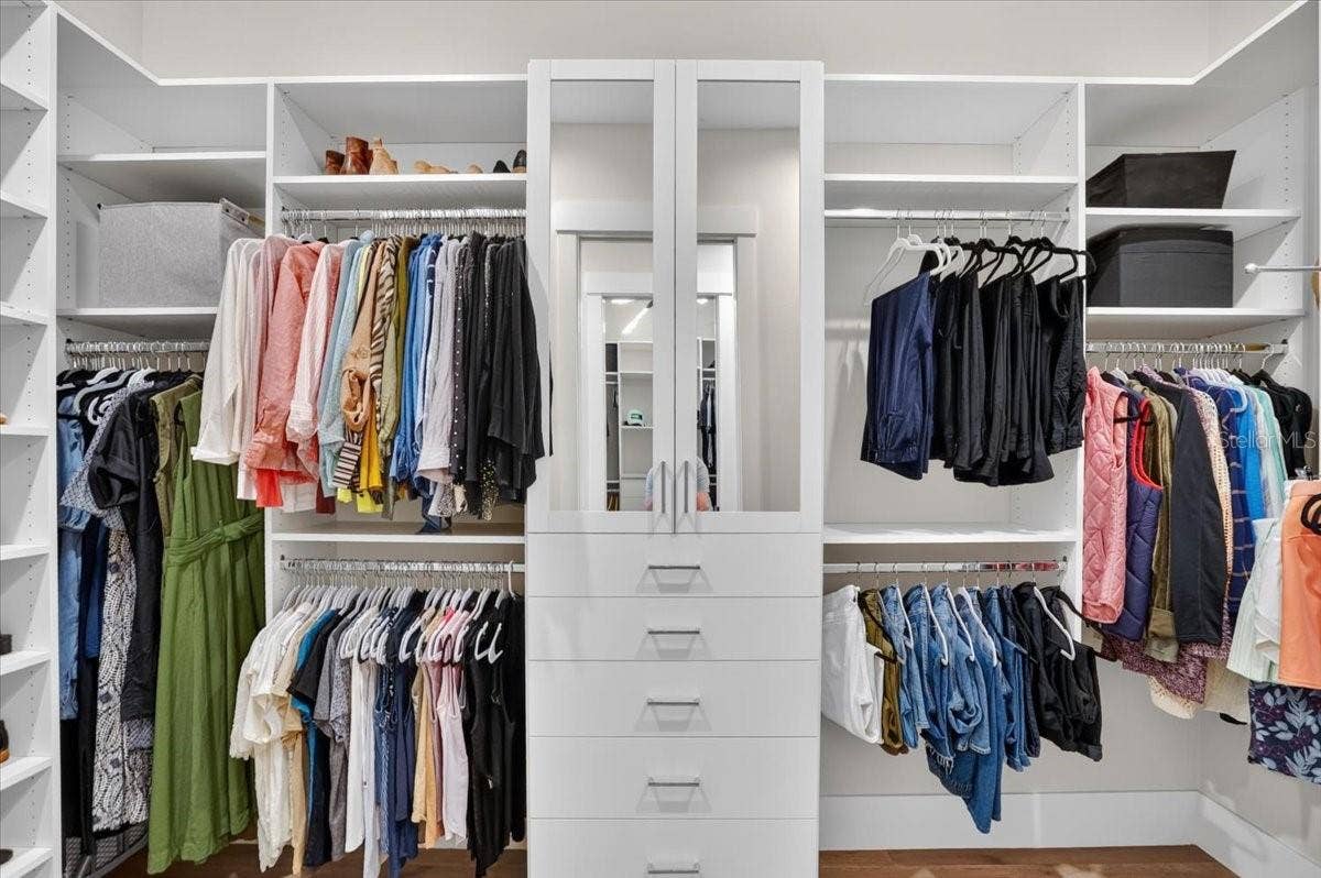 1625 RIO VISTA TERRACE, Parrish, FL 34219 Dual Walk In Closets with Custom Cabinetry and Shelving.