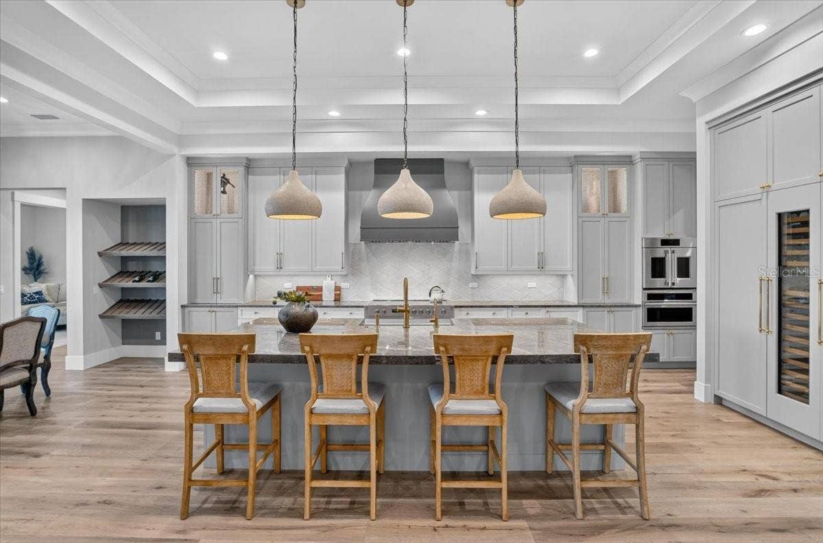 1625 RIO VISTA TERRACE, Parrish, FL 34219 Dovetail Wood Cabinetry with Display Shelving. Designer pendants.
