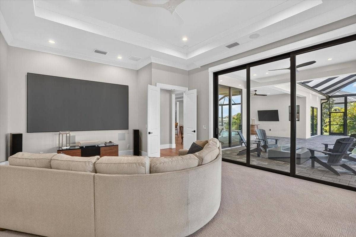 1625 RIO VISTA TERRACE, Parrish, FL 34219 140" screen, short throw projector, two in-wall subs, immersive theater quality audio