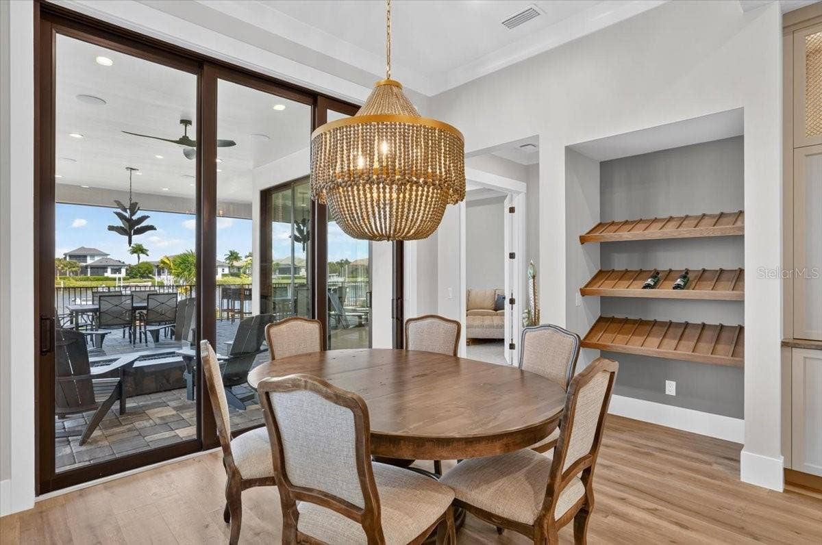 1625 RIO VISTA TERRACE, Parrish, FL 34219 White Oak, custom built Wien shelves. Designer lighting.
