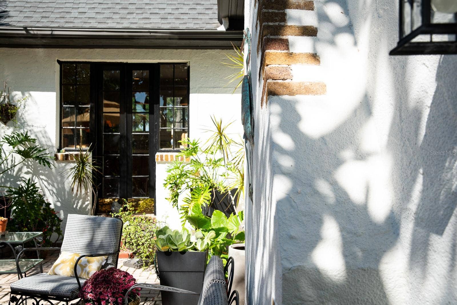 French doors from courtyard to living room (salon).