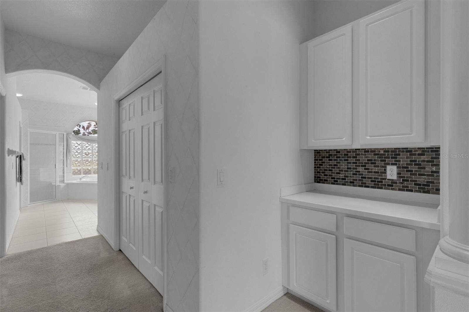 8339 BARTON FARMS BOULEVARD, Sarasota, FL 34240 primary bedroom entrance to primary bath