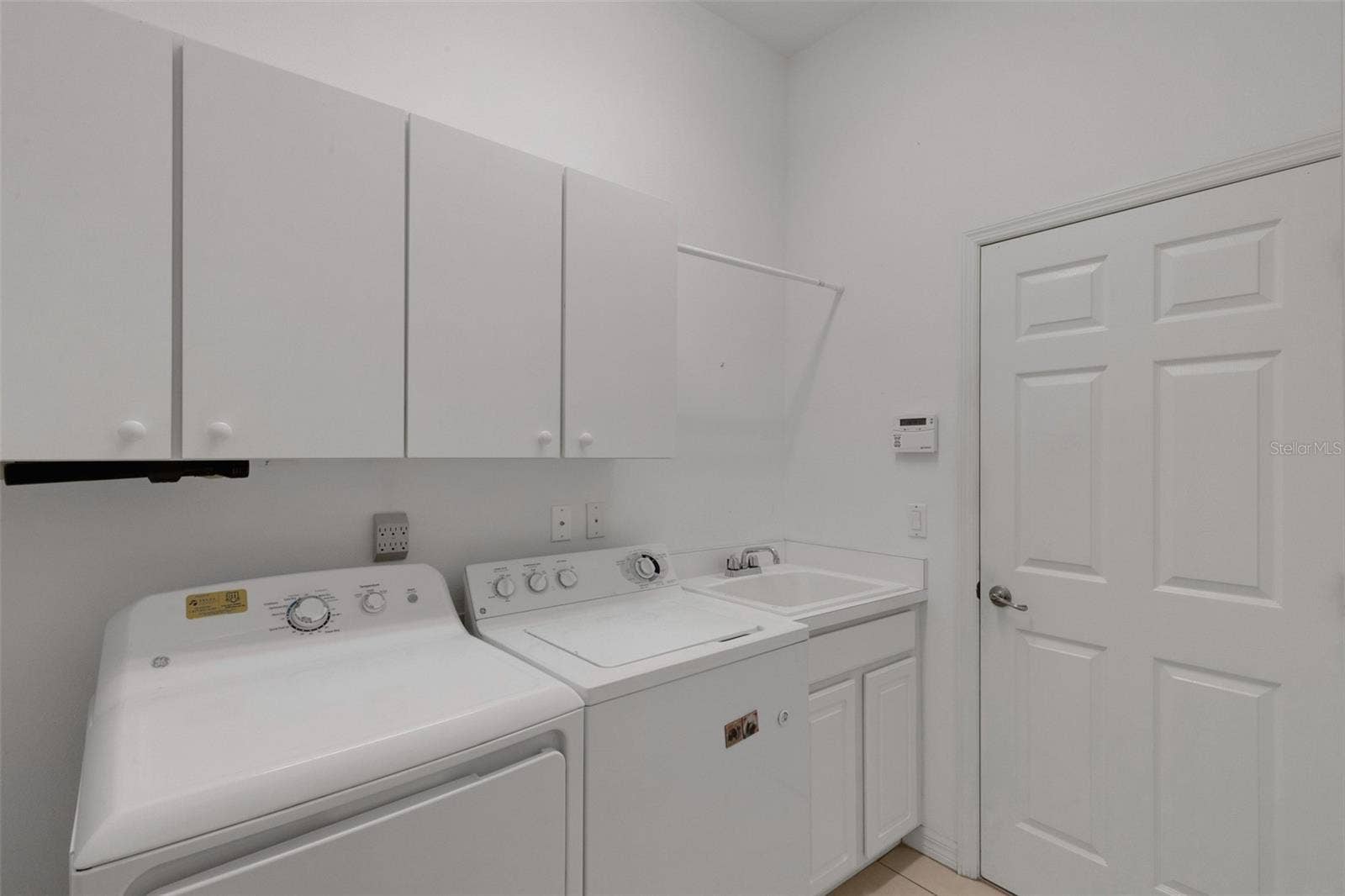 8339 BARTON FARMS BOULEVARD, Sarasota, FL 34240 laundry room (off kitchen area)
