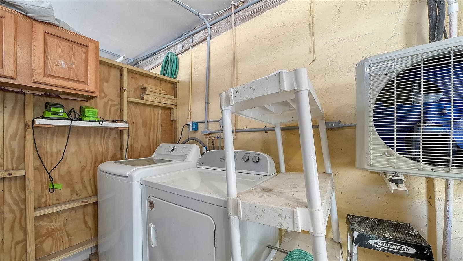 2514 AVENUE B, Bradenton Beach, FL 34217 Exterior common laundry room/storage space on the ground floor.