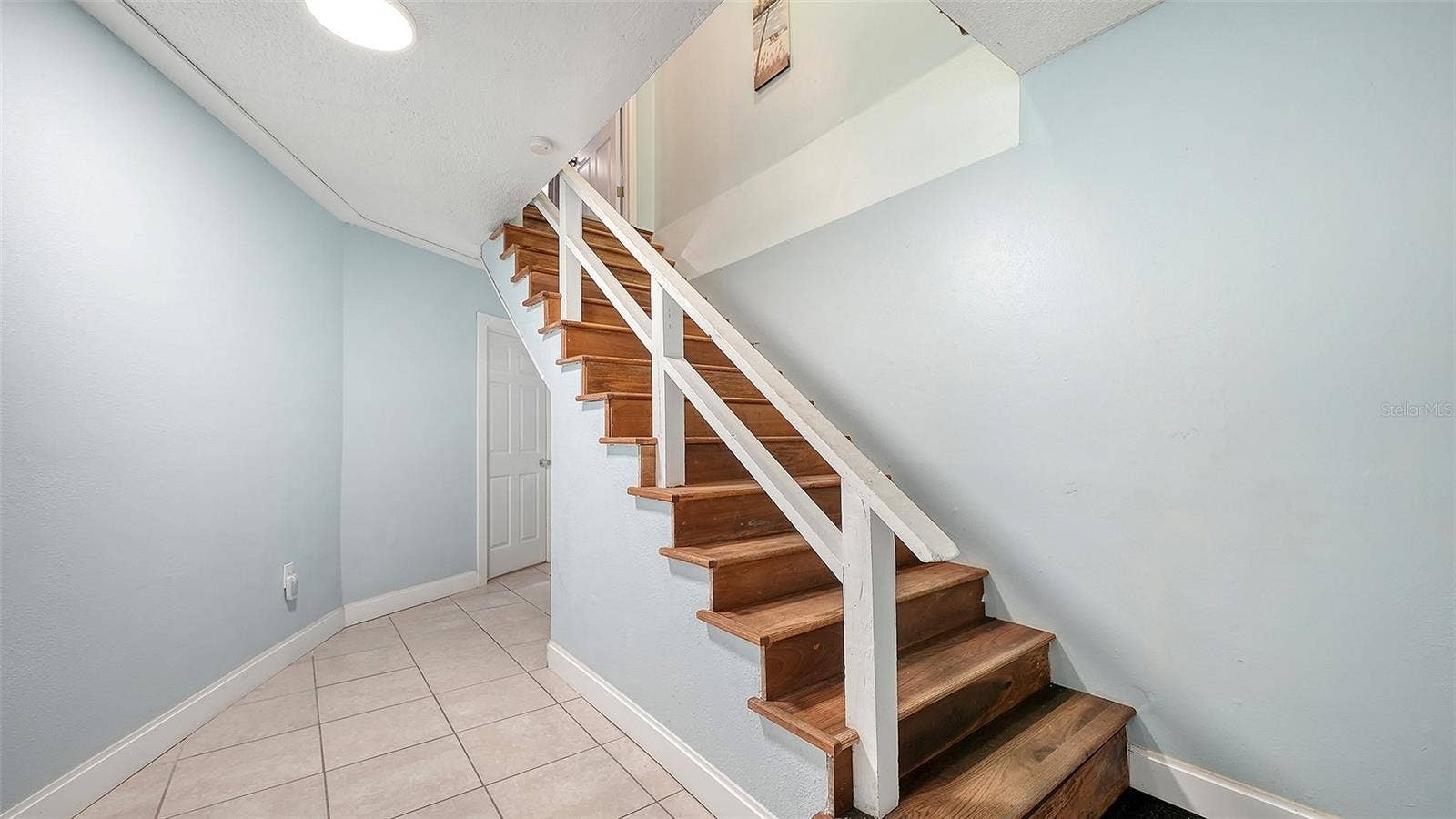 2514 AVENUE B, Bradenton Beach, FL 34217 Unit A, entry hallway and stairs to Unit A.