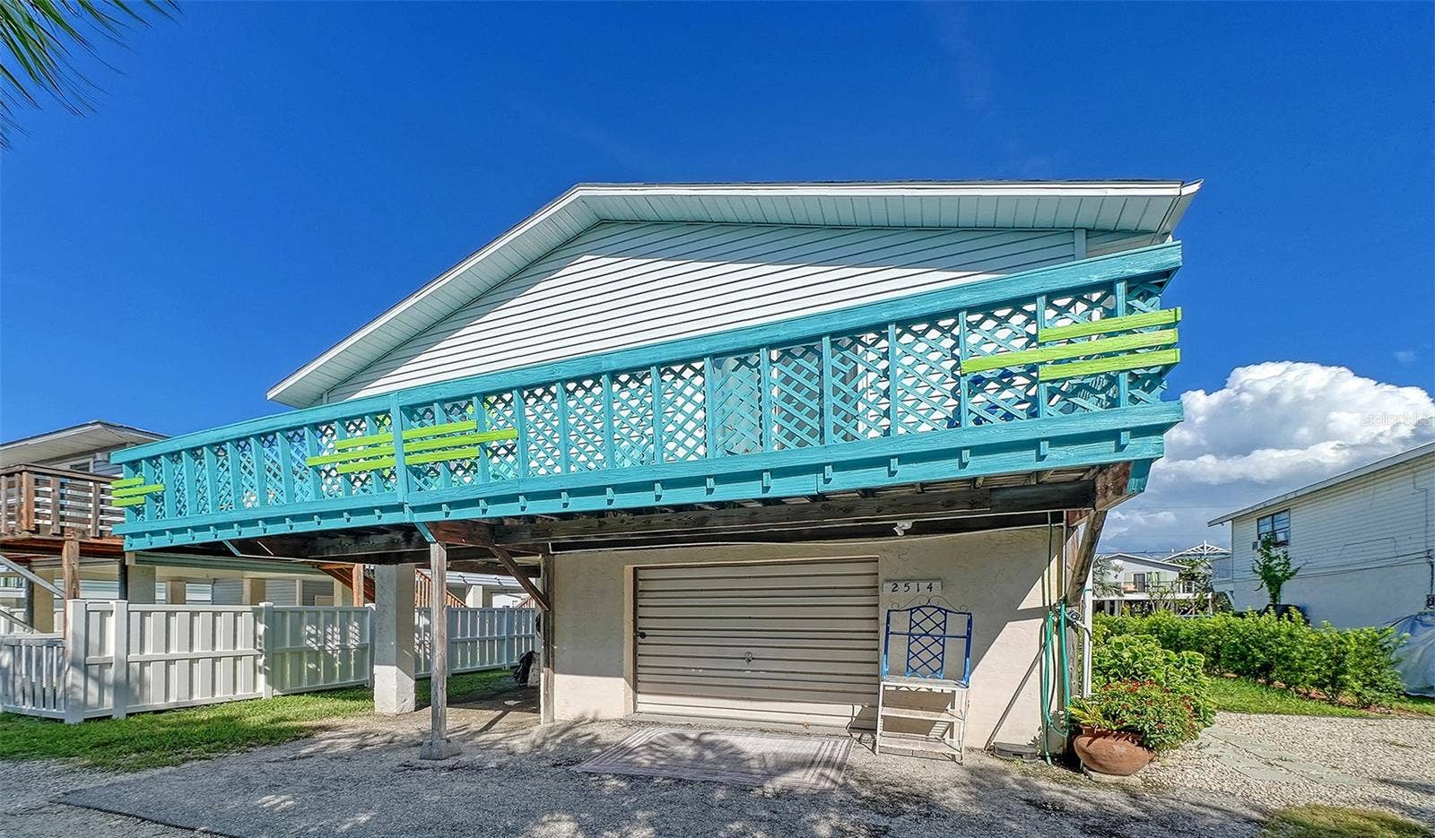 2514 AVENUE B, Bradenton Beach, FL 34217 Rear of 2514 Avenue B. Converted garage has been changed to storage area/game room.