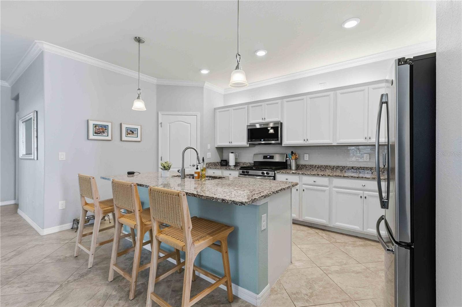 4523 BALTRY COURT, Bradenton, FL 34211 Granite Counters, Stainless GE and Bosch appliances-great walk-in pantry in corner. Natural gas range.