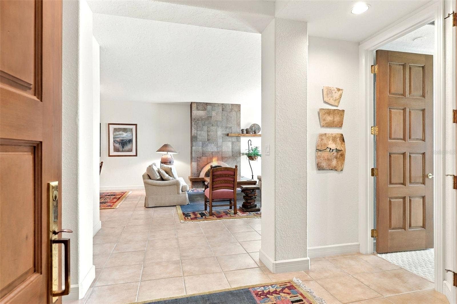 2185 GULF OF MEXICO DRIVE, #243, Longboat Key, FL 34228 The foyer opens up to the main living area, the primary suite and the kitchen.
