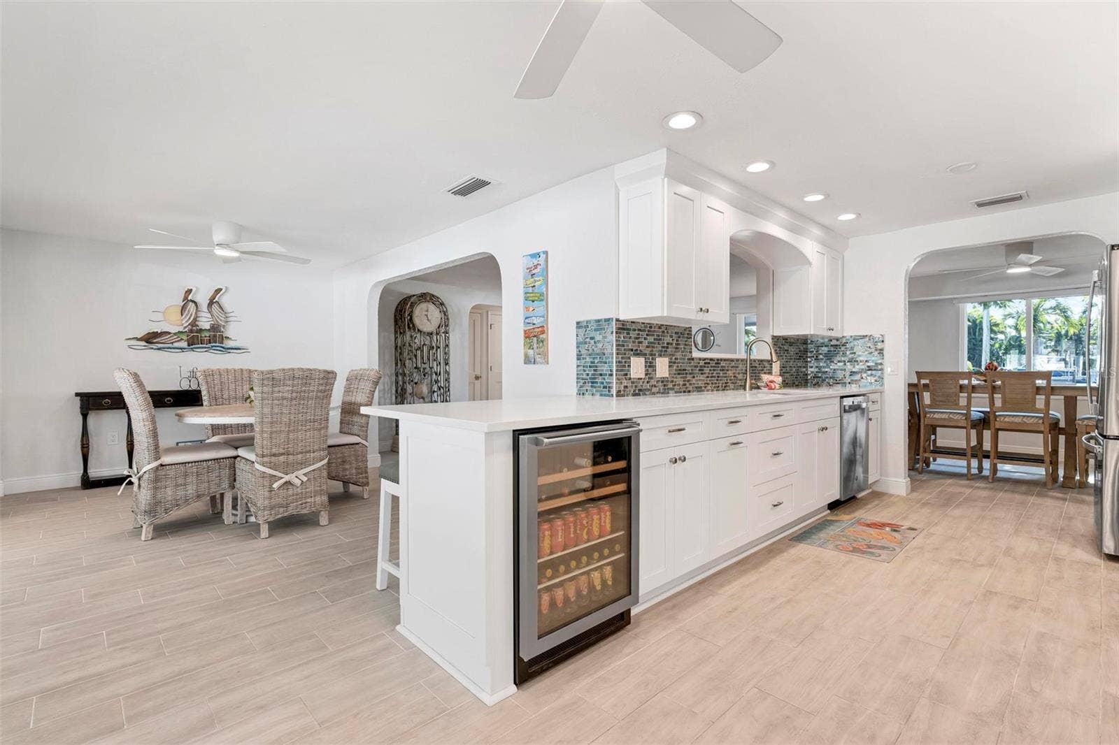 504 69TH STREET, Holmes Beach, FL 34217 Kitchen with wine fridge and eat in breakfast bar