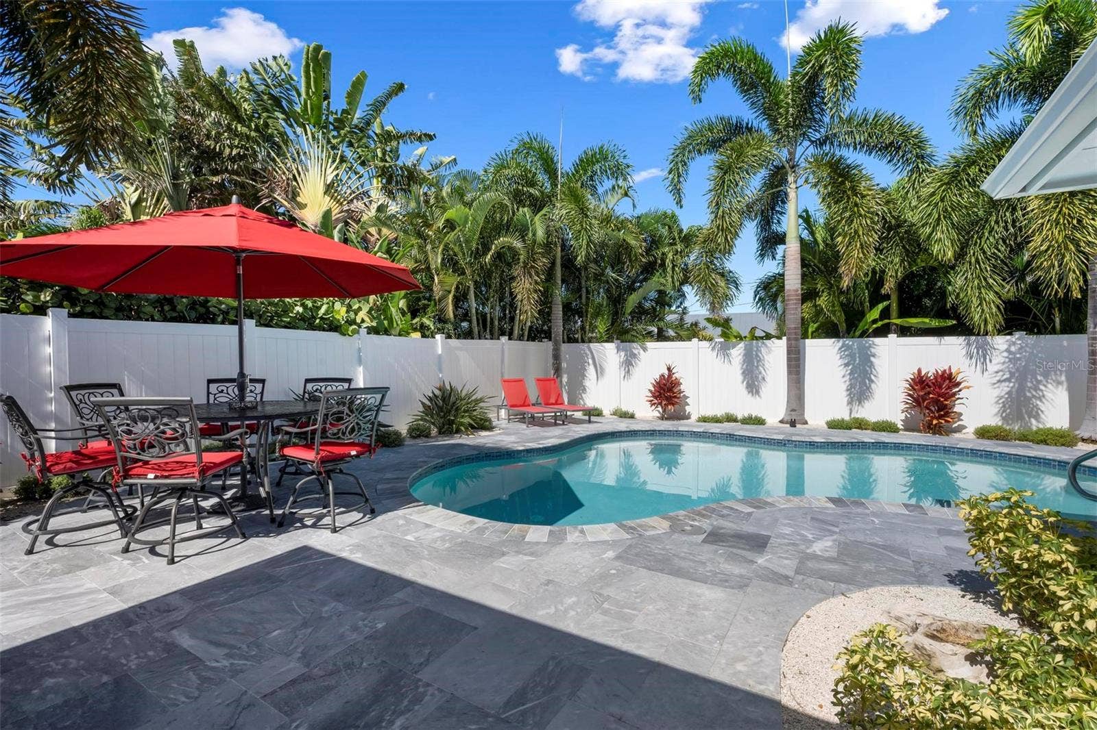 504 69TH STREET, Holmes Beach, FL 34217 Pavered outdoor pool patio with heated saltwater pool