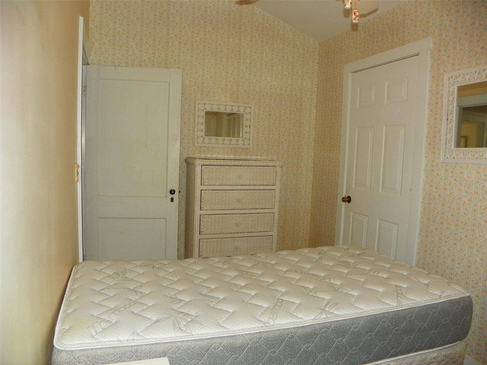 8 PLAZA STREET E, Bradenton, FL 34208 From Bedroom 1, door on right leads to storage/laundry area.