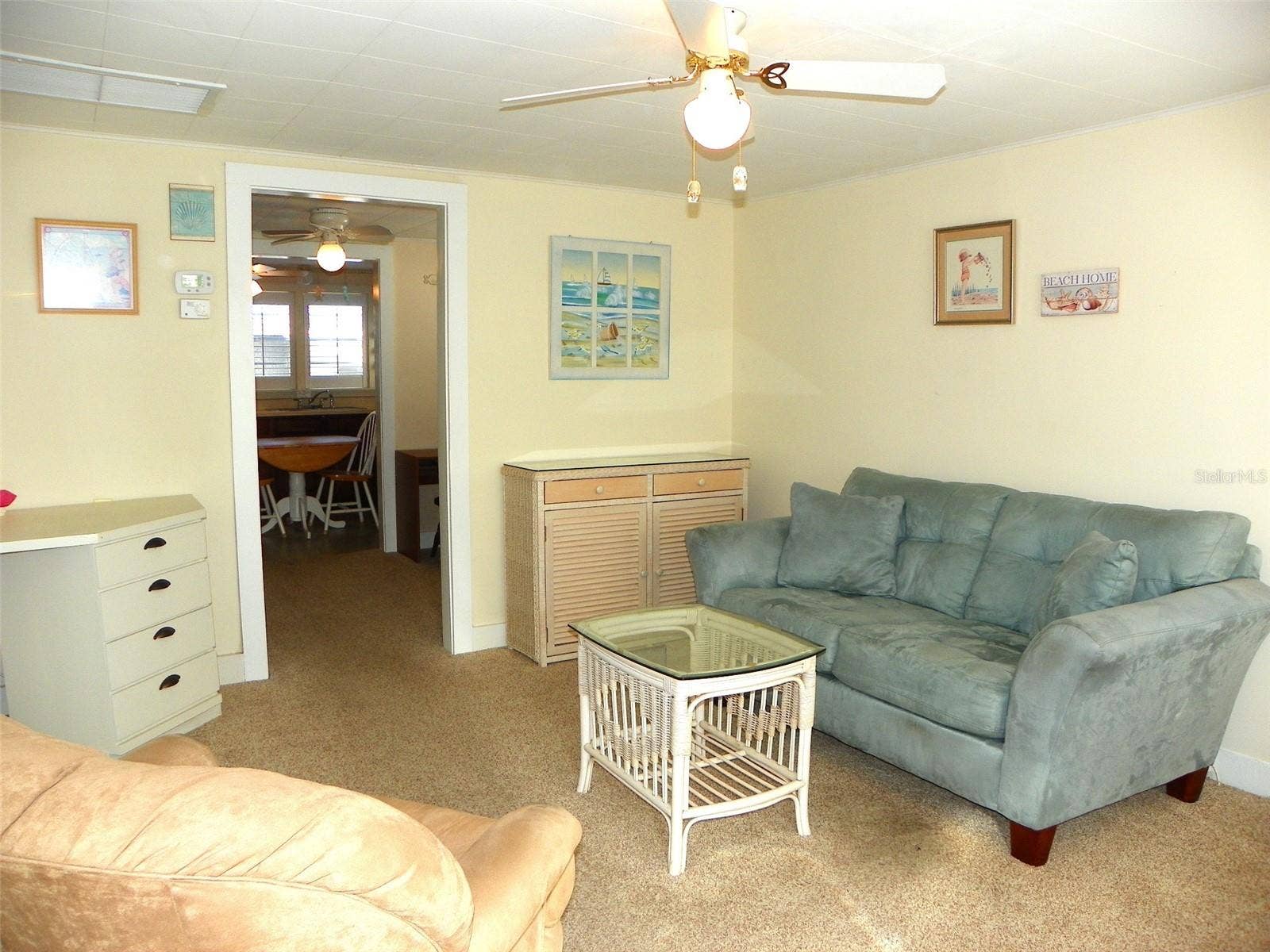 8 PLAZA STREET E, Bradenton, FL 34208 Living Room looking into dining room and kitchen