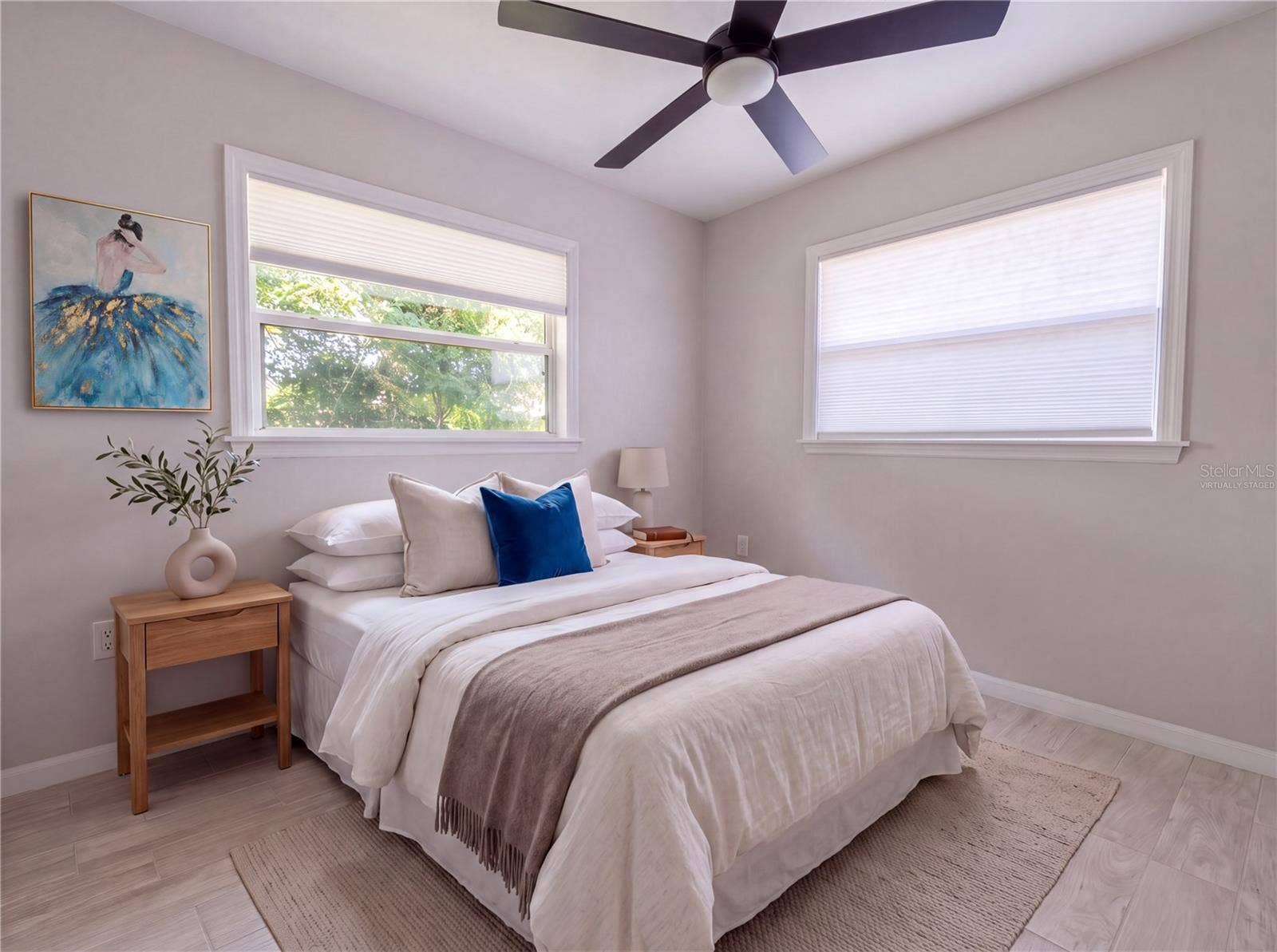 Bedroom 1. All new flooringporcelain tile.Virtually Staged