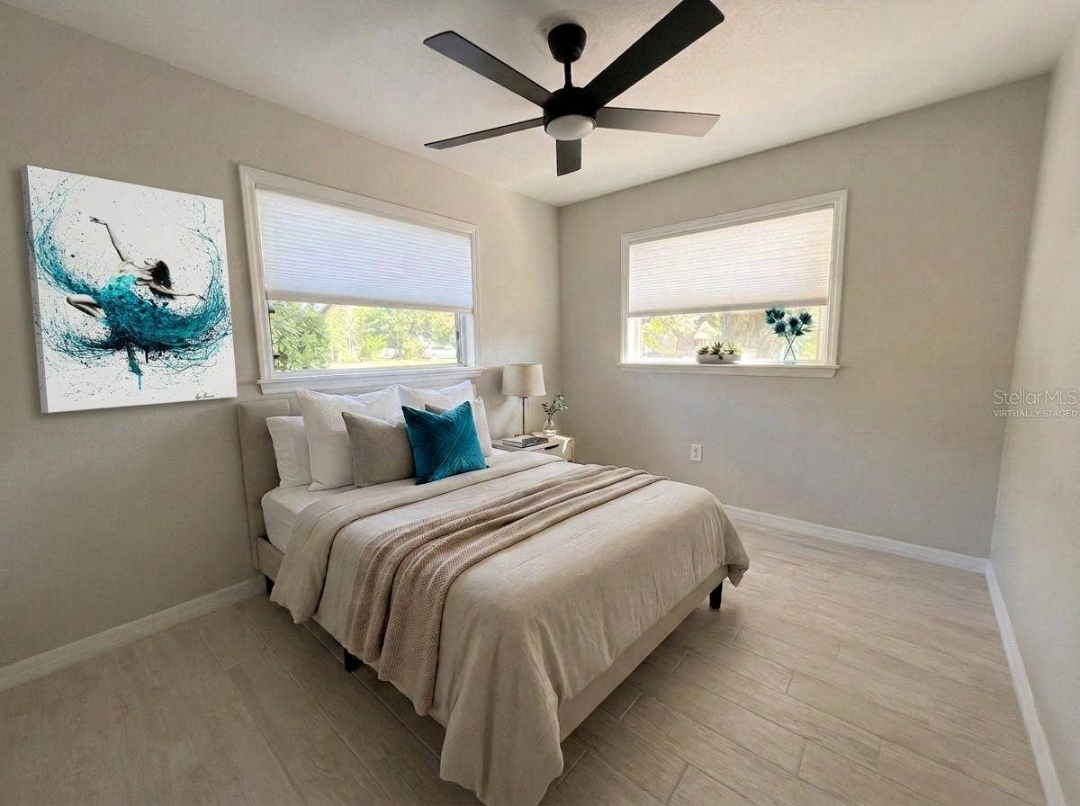 Bedroom 2. All new flooringporcelain tile.Virtually Staged