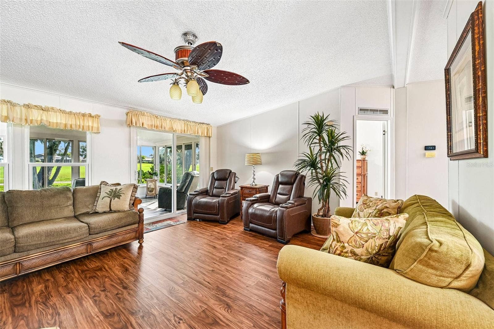 8510 COUNTESS AVENUE CIRCLE, Palmetto, FL 34221 Partial View of Back Lanai and Golf Course from Spacious Living Room