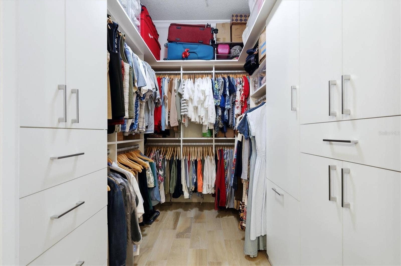 7920 34TH AVENUE W, #303, Bradenton, FL 34209 Primary walk-in closet with custom built-ins