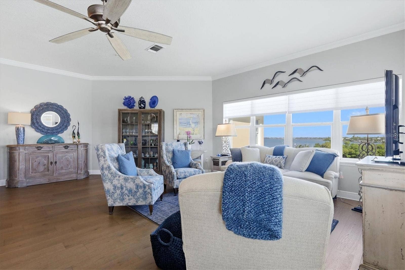 7920 34TH AVENUE W, #303, Bradenton, FL 34209 Living room has partial bay view.