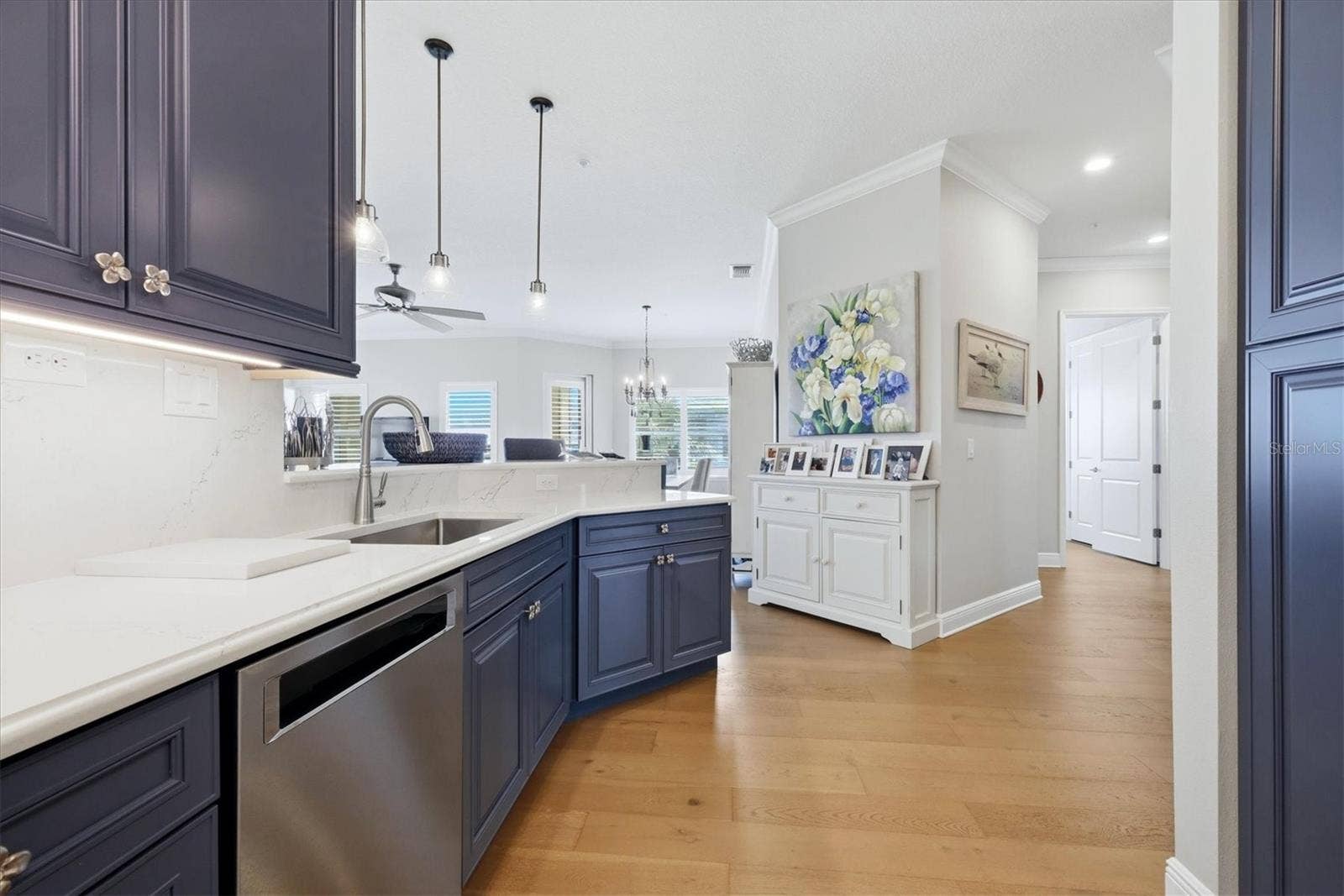 7920 34TH AVENUE W, #303, Bradenton, FL 34209 Kitchen has custom cabinetry, quartz countertops.