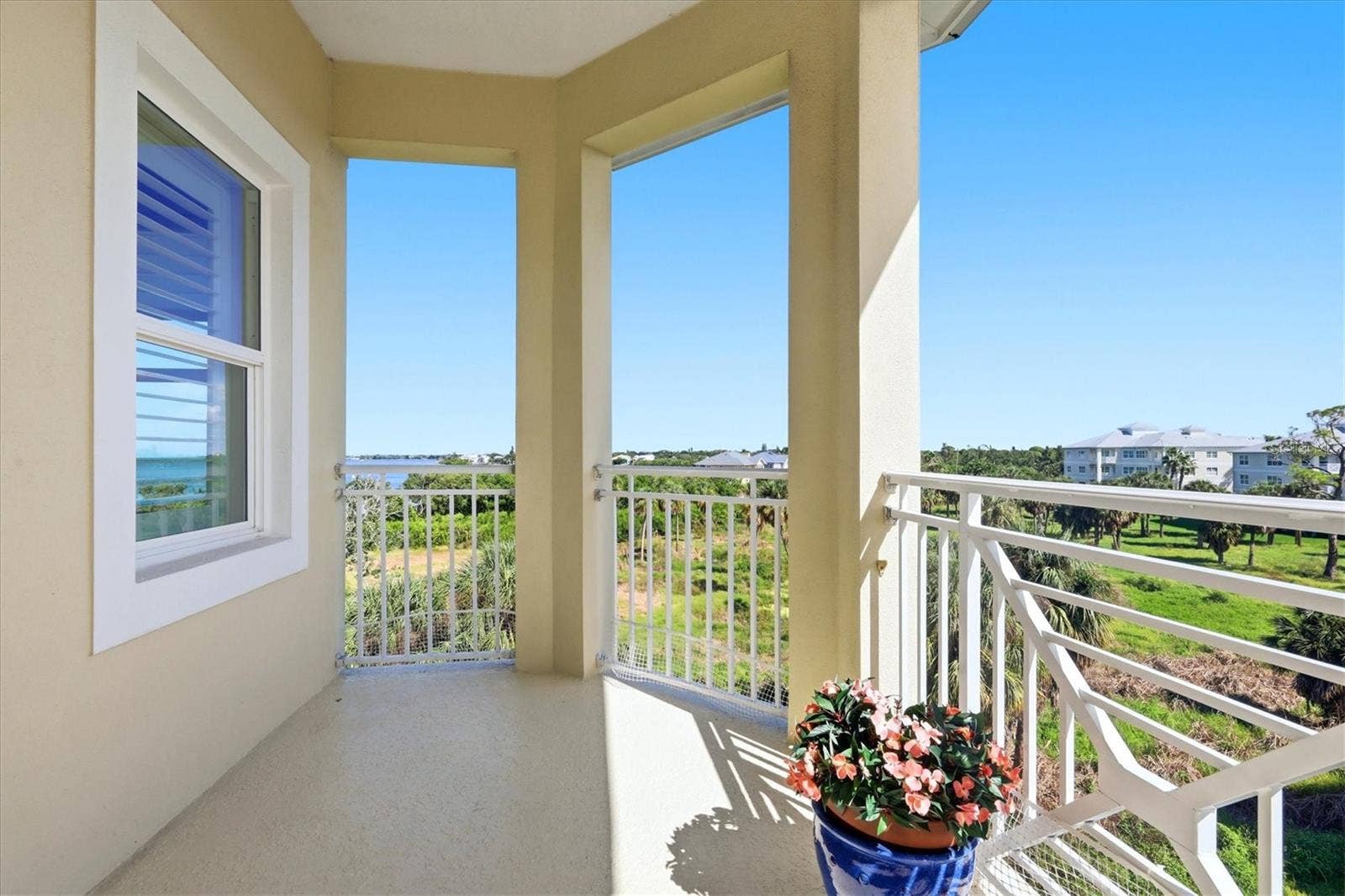 7920 34TH AVENUE W, #303, Bradenton, FL 34209 Balcony off the living room with bay view.