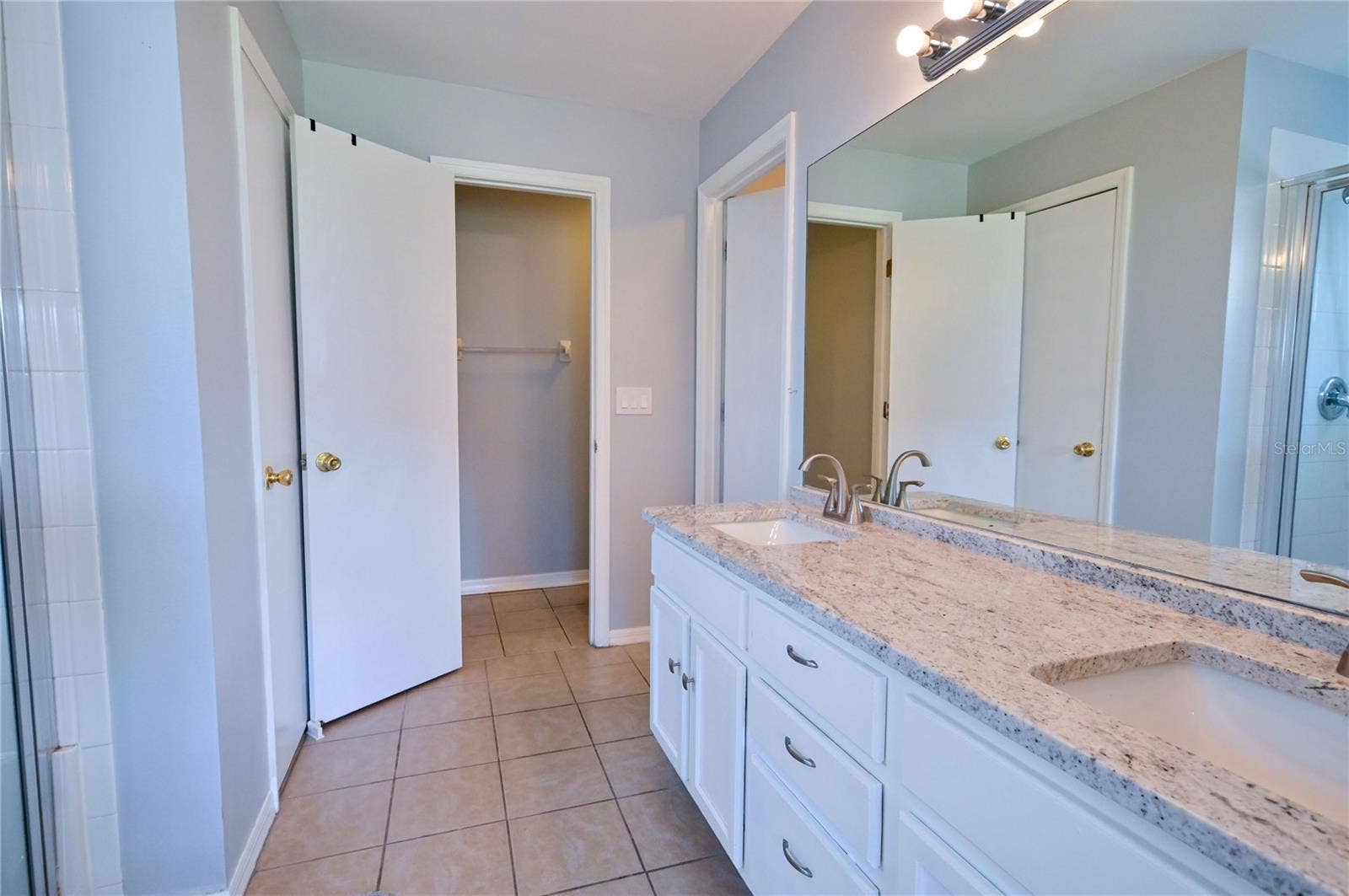 4680 56TH DRIVE E, Bradenton, FL 34203 Master bath with walk in shower and walk in closet