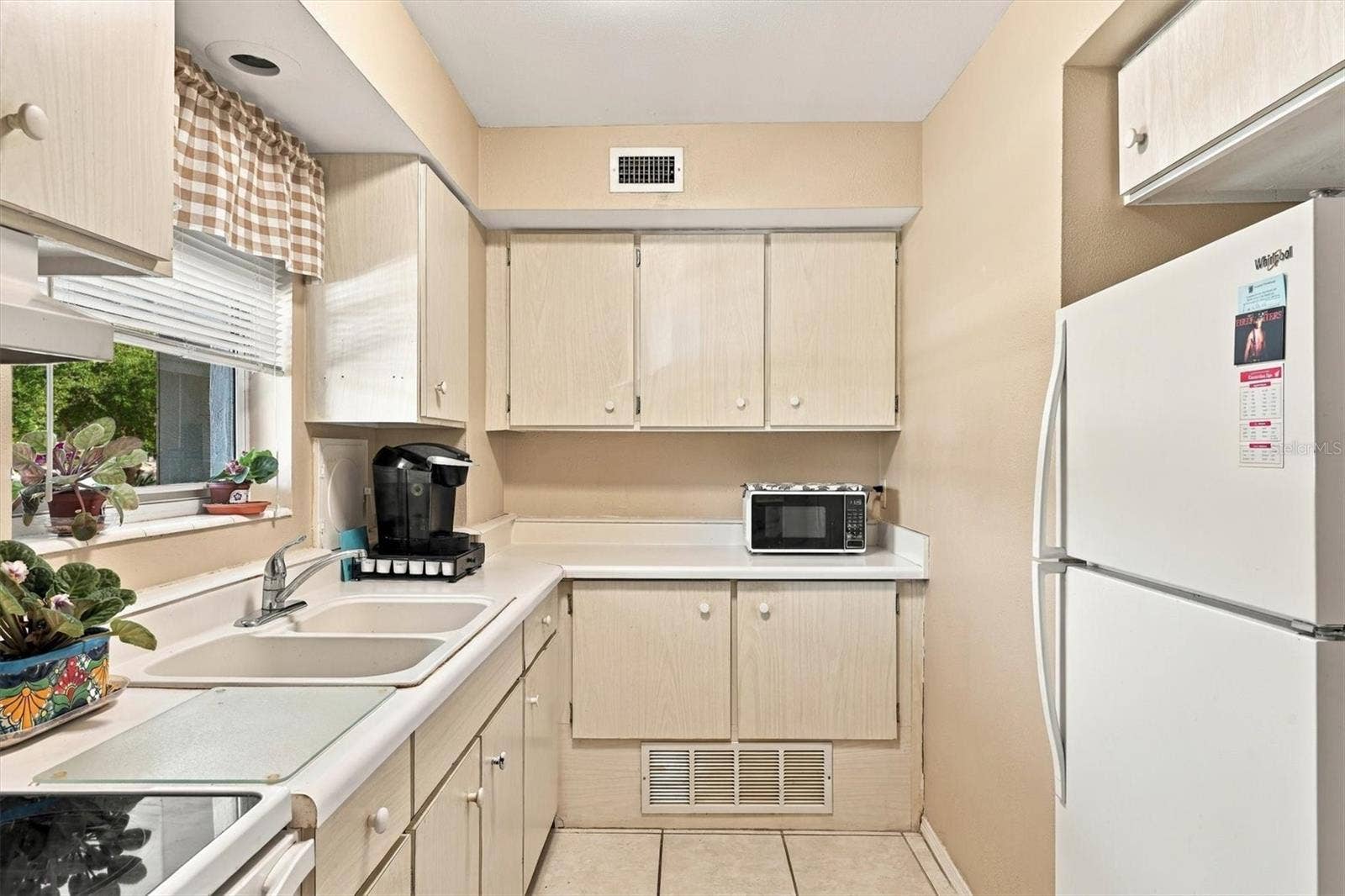 3950 ROXANE BOULEVARD, #3B, Sarasota, FL 34235 refrigerator in kitchen