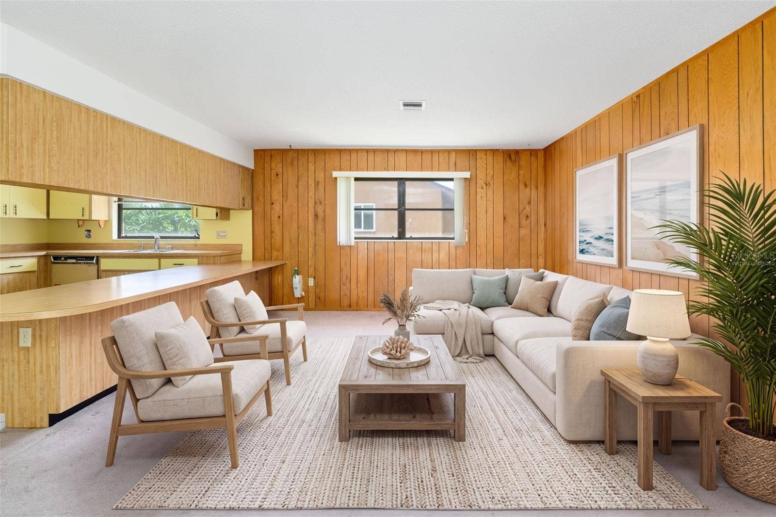 Virtually Staged. Family room open to the kitchen with a long breakfast bar.