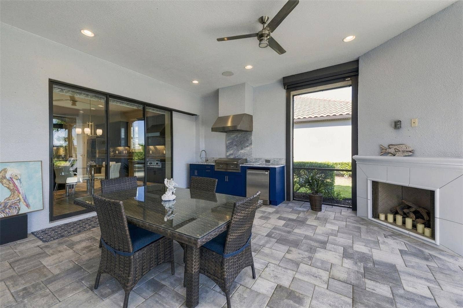 4723 BENITO COURT, Bradenton, FL 34211 Outdoor Kitchen and Dining with a Fireplace