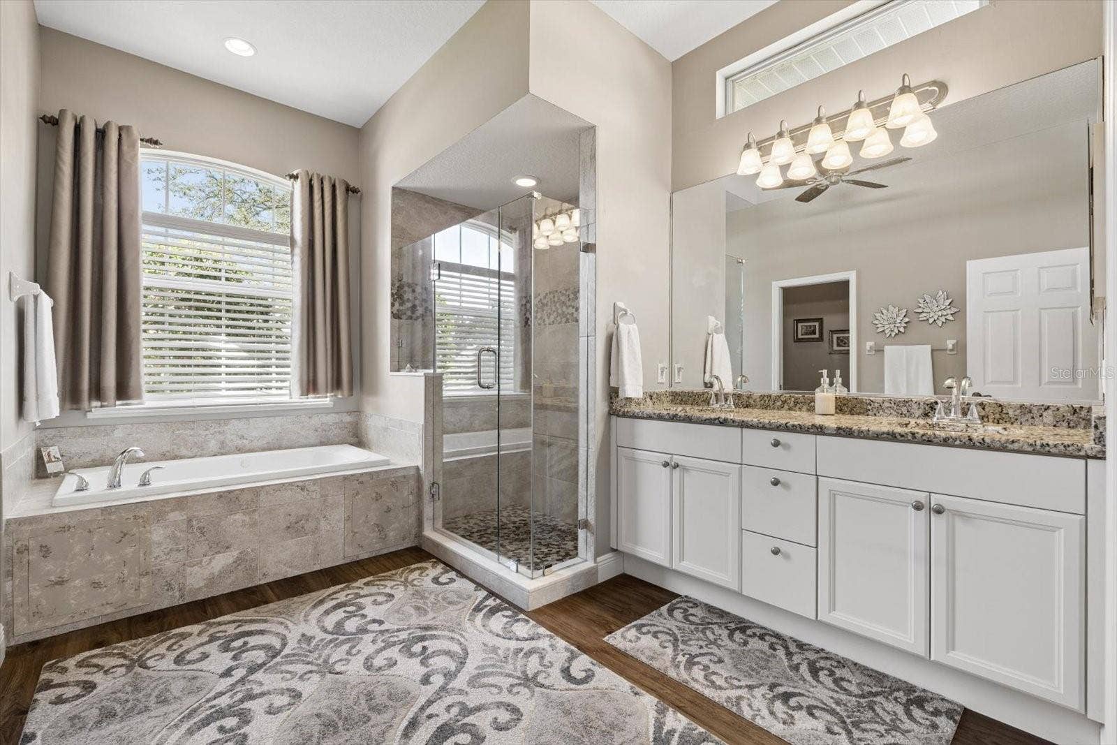 9921 LAUREL VALLEY AVENUE CIRCLE, Bradenton, FL 34202 Primary Bathroom with dual sinks, tub and walk in shower