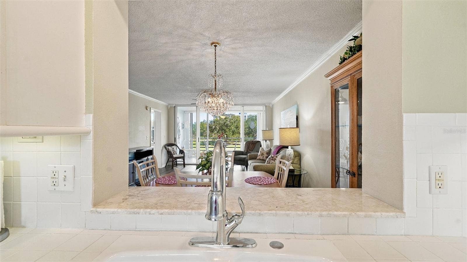 4550 PINEBROOK CIRCLE, #203, Bradenton, FL 34209 View of Combination Dining/Living Room from Kitchen