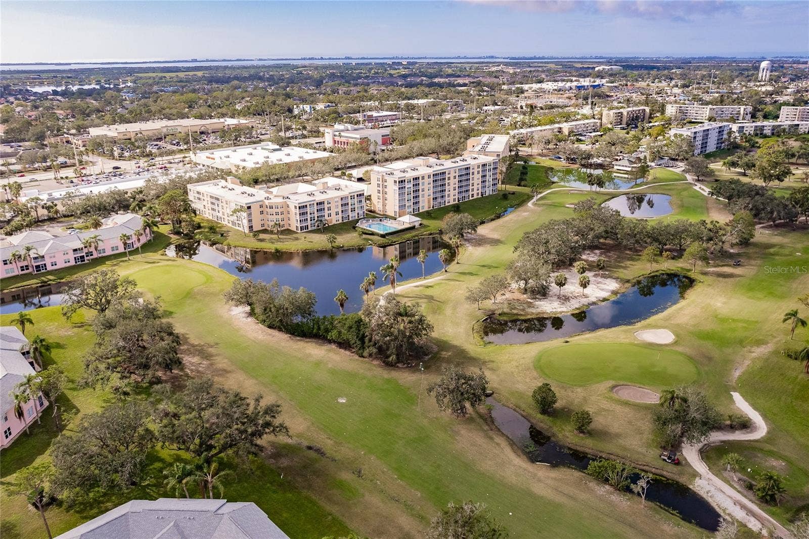 4550 PINEBROOK CIRCLE, #203, Bradenton, FL 34209 Overview of golf course and building