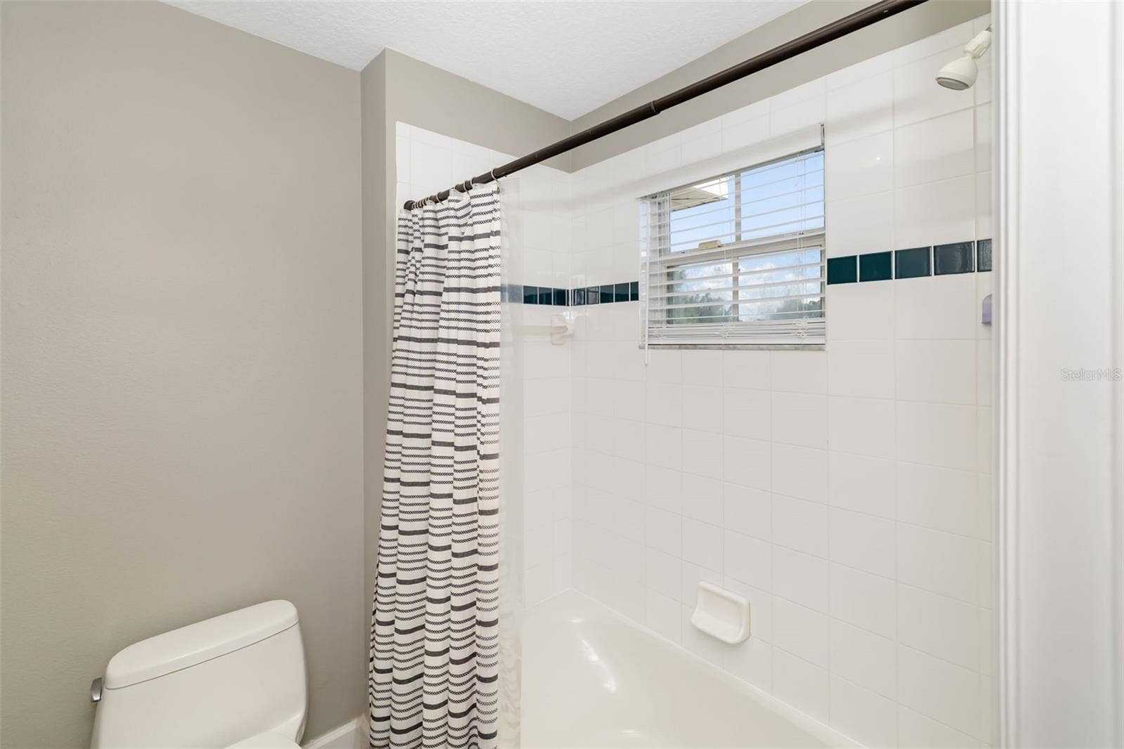 124 41ST CIRCLE E, Bradenton, FL 34208 Bathroom 3 - Tub/Shower, with door that closes for privacy from vanity area