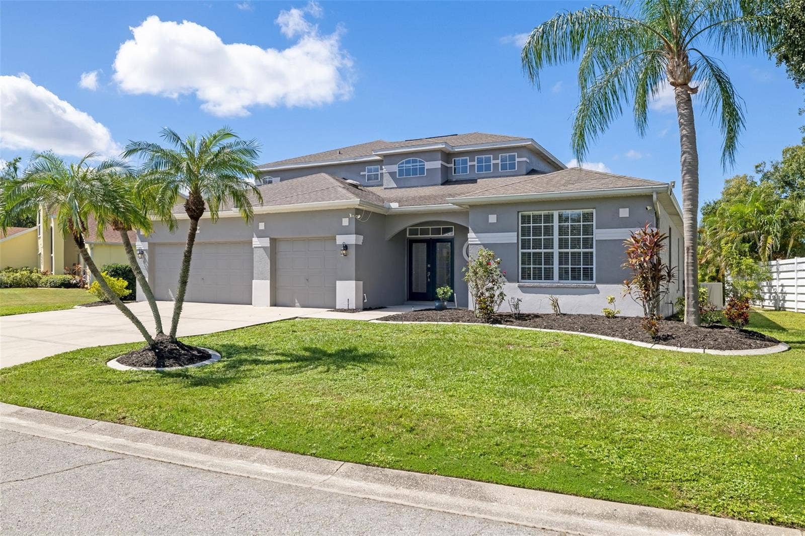 124 41ST CIRCLE E, Bradenton, FL 34208 Front Elevation - 3 car garage