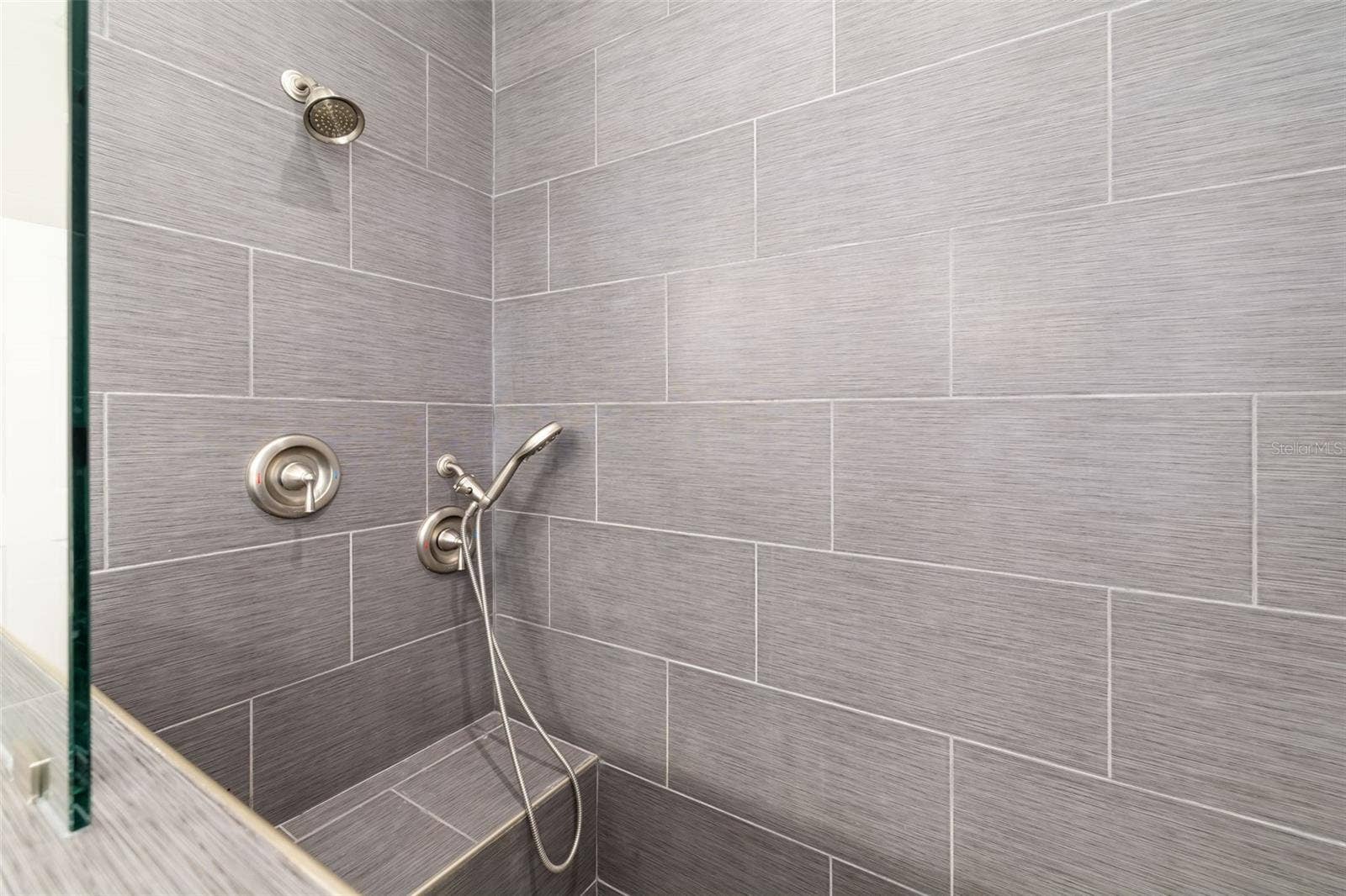 124 41ST CIRCLE E, Bradenton, FL 34208 Primary Bathroom - Walk-In Shower w/bench, multiple shower heads