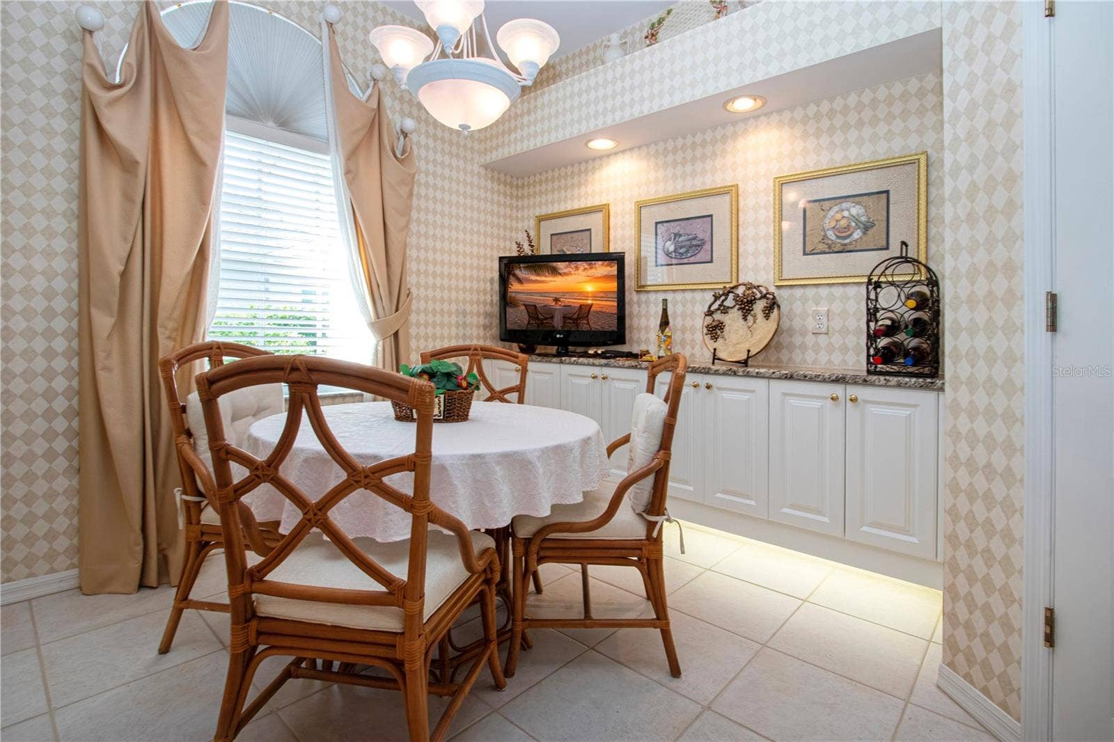 4937 CHASE OAKS DRIVE, Sarasota, FL 34241 Kitchen table and lighted buffet server
