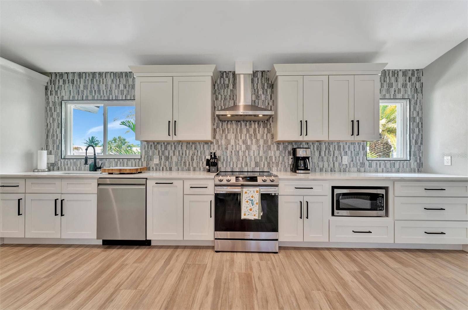 10115 KINGFISHER ROAD E, Bradenton, FL 34209 Chef-inspired kitchen with quality appliances, wine and beverage refrigerators, and wet bar.