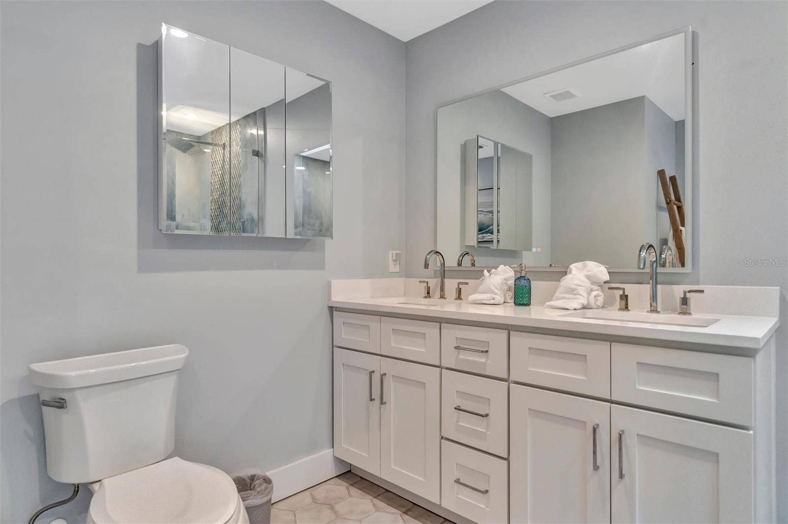 10115 KINGFISHER ROAD E, Bradenton, FL 34209 Spacious primary ensuite with double vanity and walk-in rain shower.