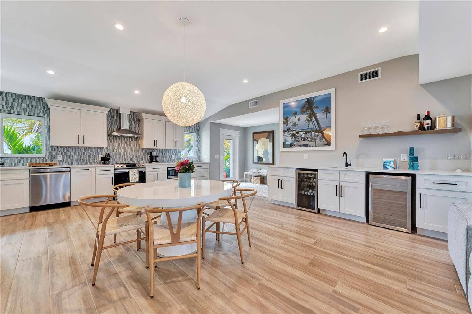 10115 KINGFISHER ROAD E, Bradenton, FL 34209 Chef-inspired kitchen with quality appliances, wine and beverage refrigerators, and wet bar.